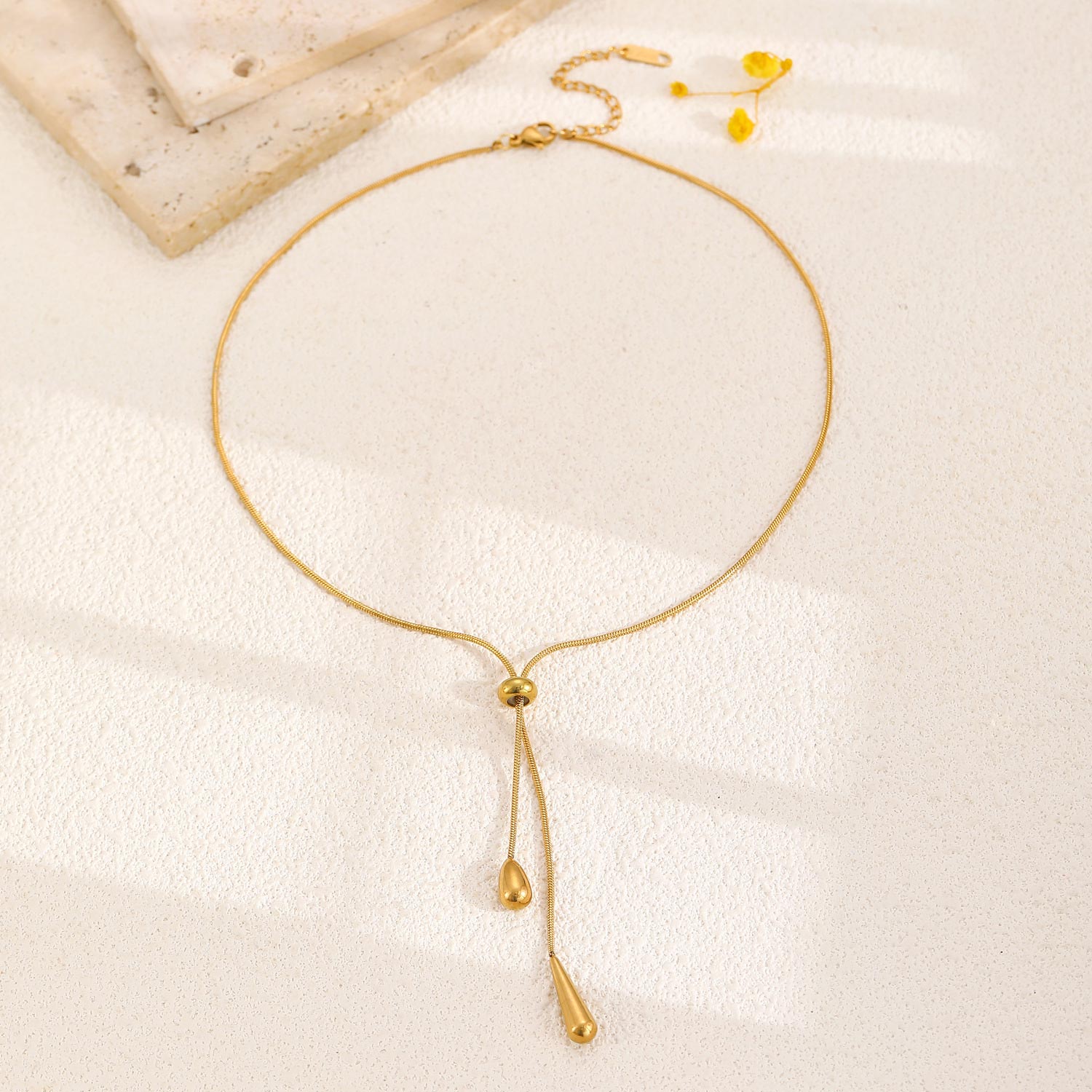 Golden Stainless Steel Teardrop Earrings and Necklace | picture 